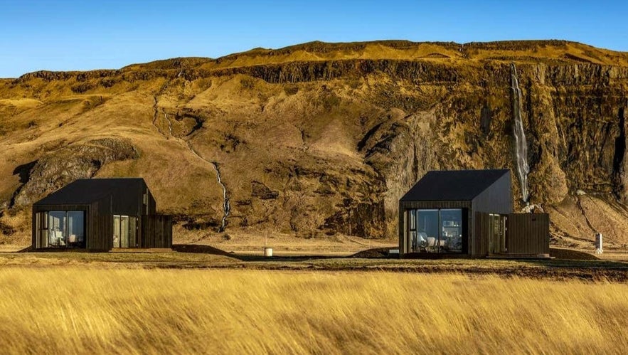 Seljalandsfoss Horizons Lodges with mountain backdrop and waterfalls on Iceland's South Coast
