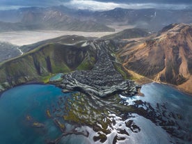 Aerial view of the rugged lava fields and colorful rhyolite mountains in Landmannalaugar, Iceland.