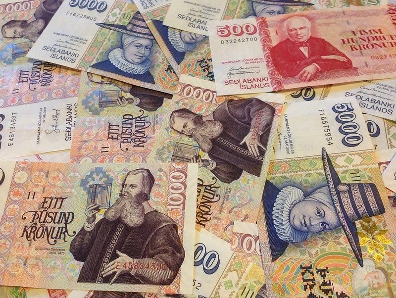 Icelandic krona banknotes in various denominations with historical figures and colorful designs