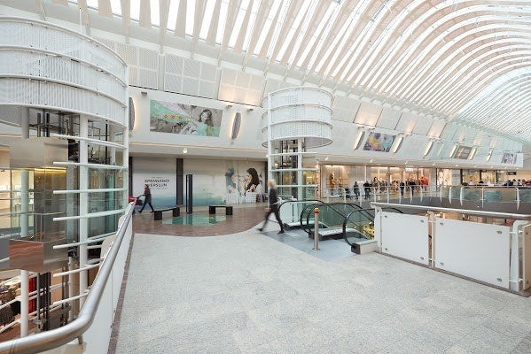 Inside view of Smaralind shopping mall in Iceland with modern architecture and escalators
